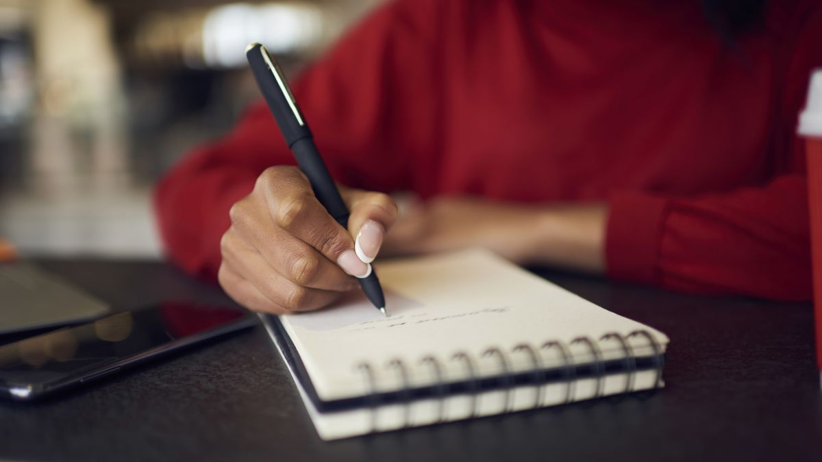 image of lady writing a list to ensure she is productive and help her ADHD management.